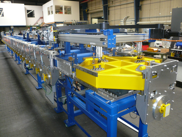 Conveying system for automotive parts