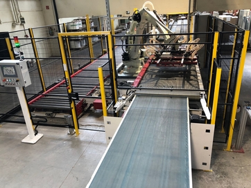 Robot stacker with conveyor tracking 