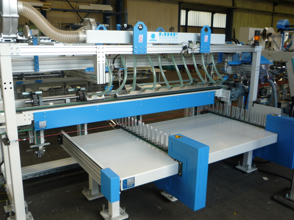 Infeed system for mesh wrapping line